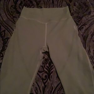 Alphalete dark green laser cut leggings.